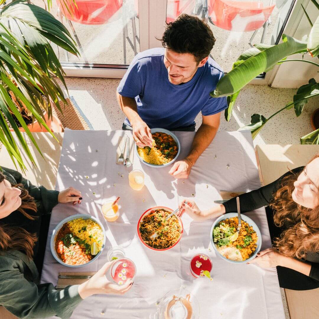 Creatives meeting and talking over lunch